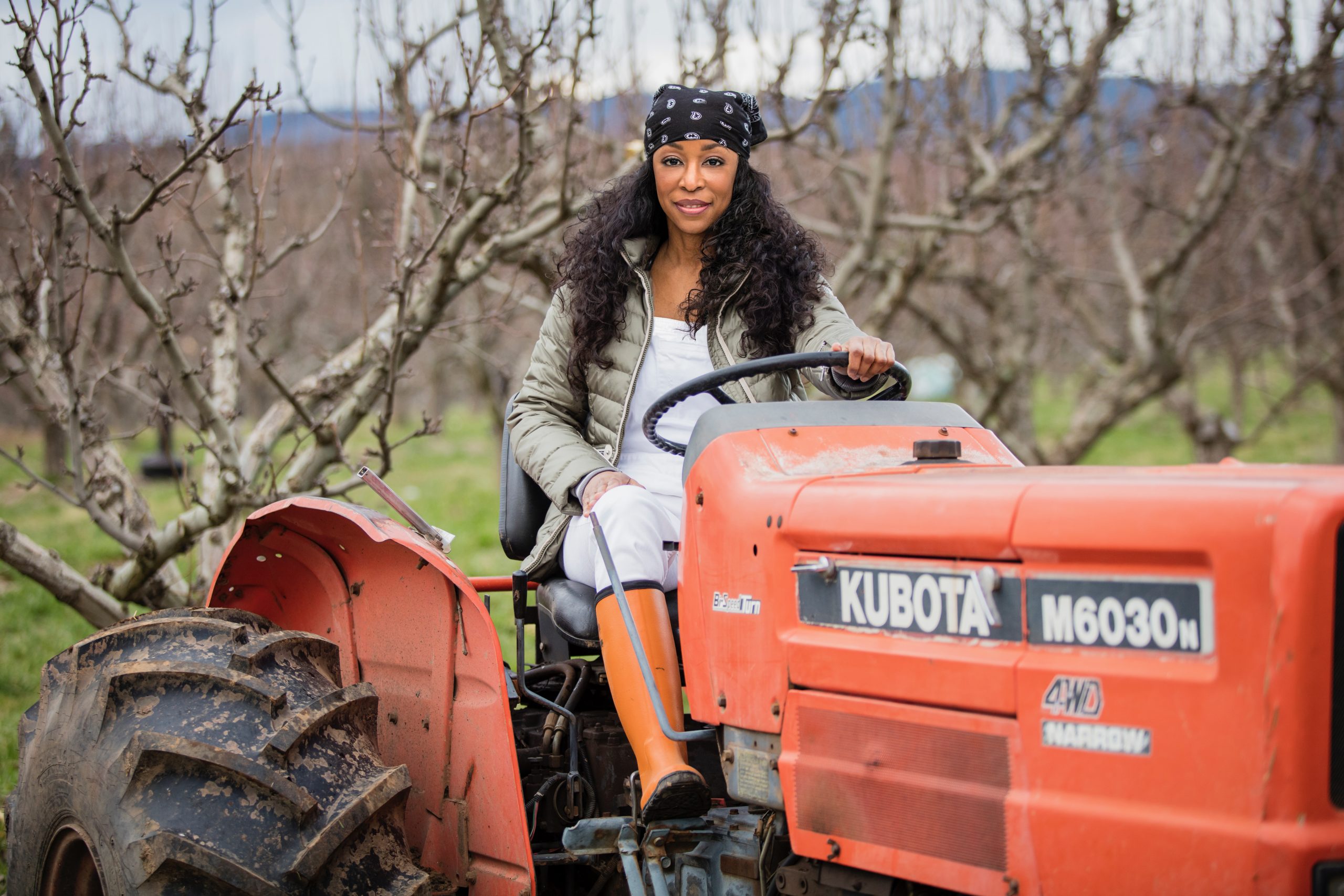 Jacqueline (Jackie) Alexander on a tractor